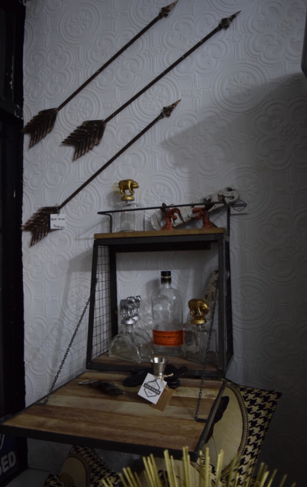 How cute is this little wall bar? (It doesn't have to be a bar by the way, you can put anything on the shelves, but I love the idea of using it this way!) The animal decanters are great too! And let's not ignore those cool arrows.
