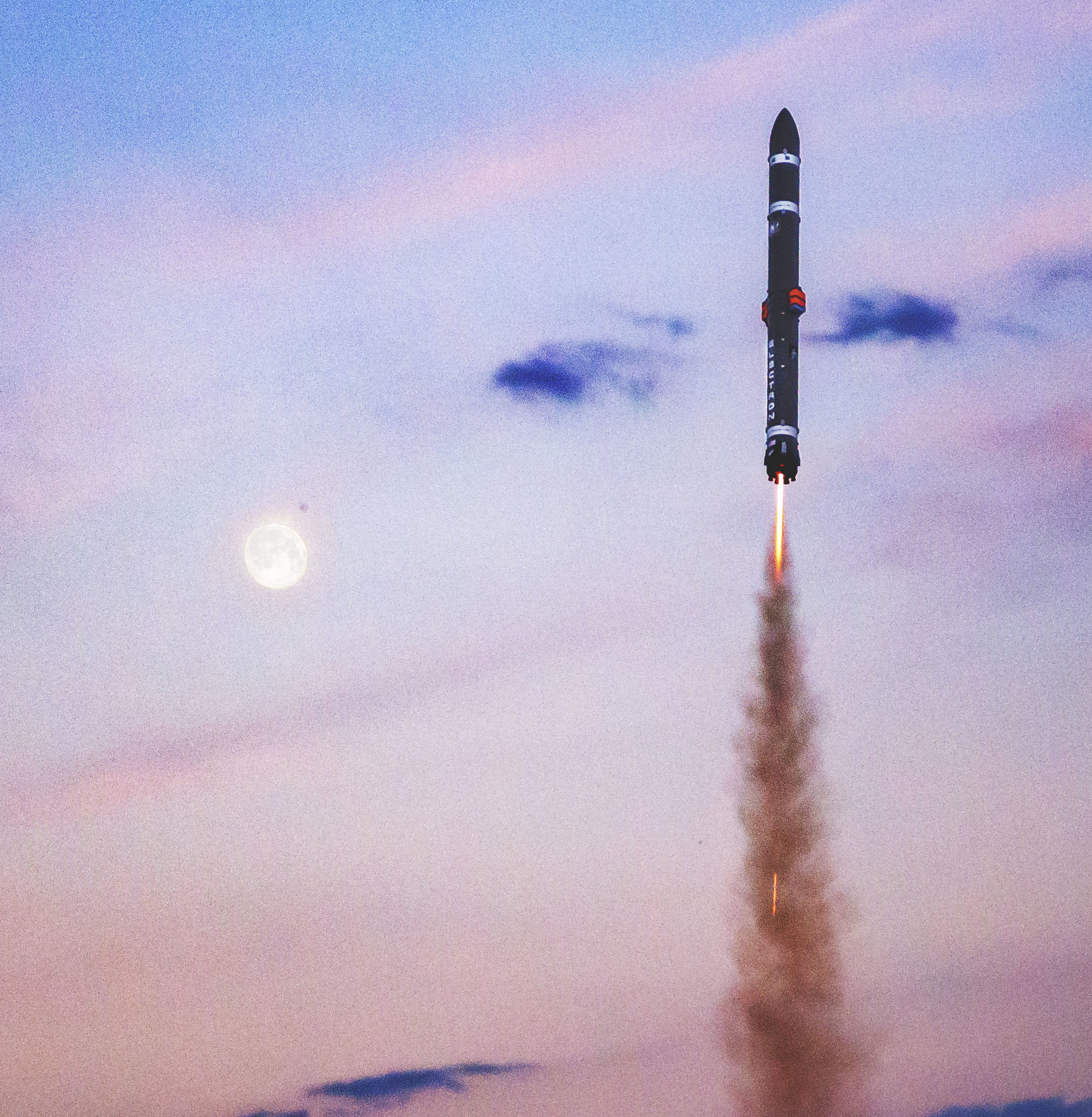 Electron soars past the moon at dusk