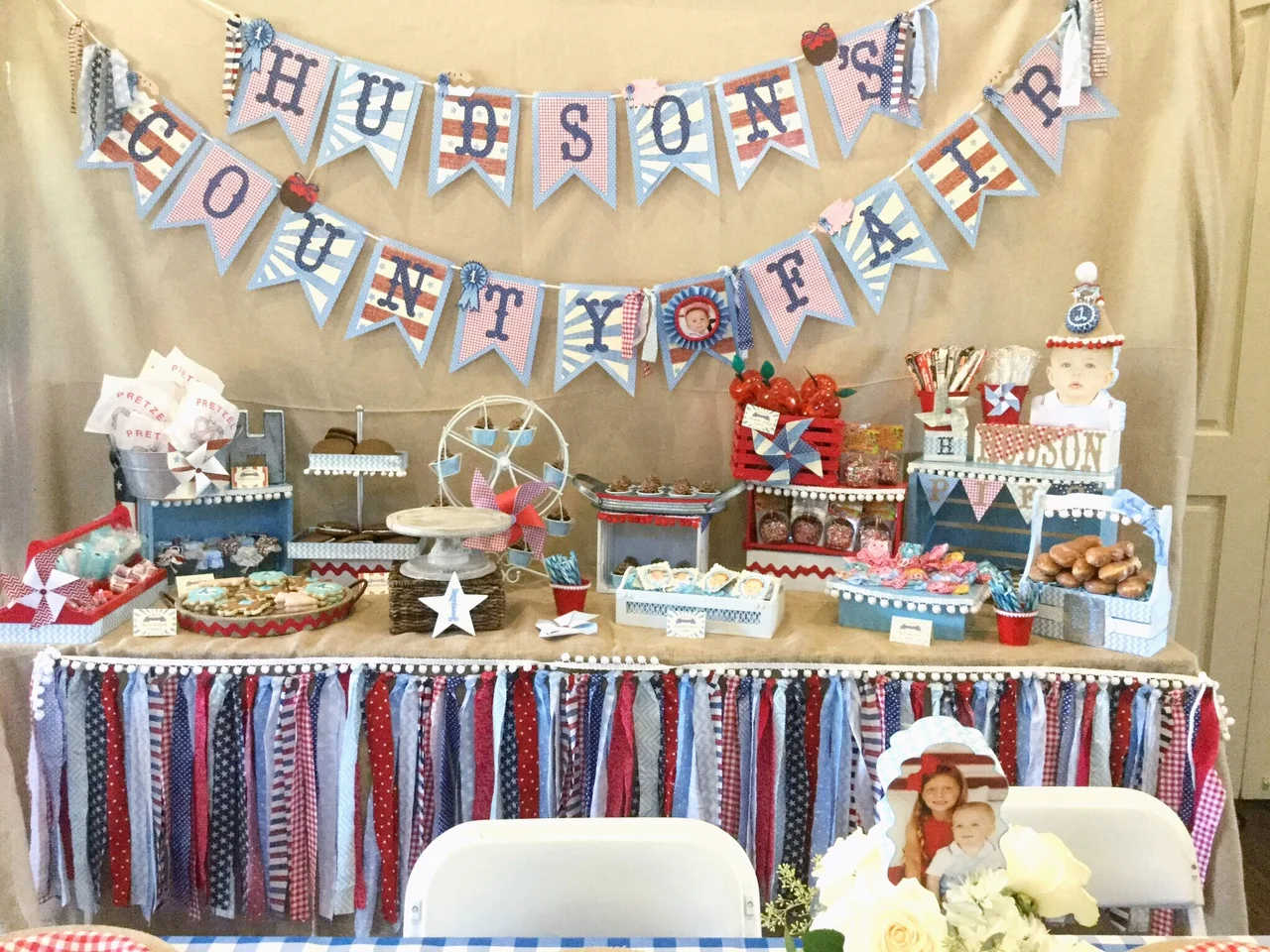 This dessert table was the focal point of the room and it was so cute! I had everything on there I could think of that that was fair-related-- mini apple pies, whoppee pies, donuts, soft-pretzels, sugar-cookies, cupcakes, candy, caramel apples, and …