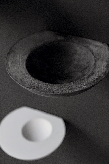 Medium black and small white wall bowls
