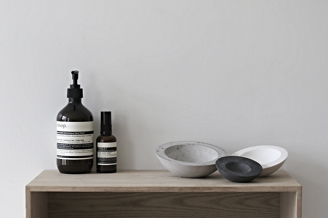 Grouping of three porcelain bowls in Large gray, medium white, and small black.
