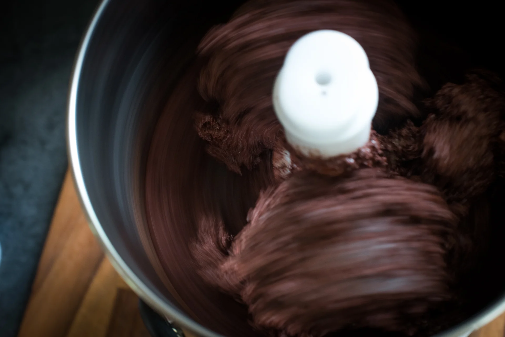 The roasted cocoa beans (seeds, actually) are refined in a stone grinder for several days.