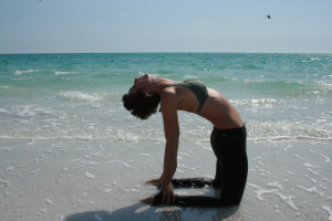 If you can't reach your heels, place your hands on your back like you're putting them in back jean pockets. Keep your hips forward over your knees and place the knees no more than 2 fists width apart. Reach up with that sweet, sweet heart!