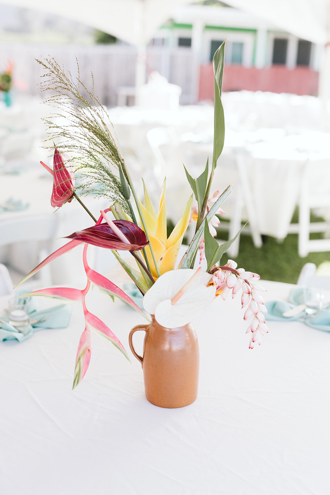Mokuleia-North-Shore-Hawaii-Beach-House-Wedding-reception-details-floral-centerpieces