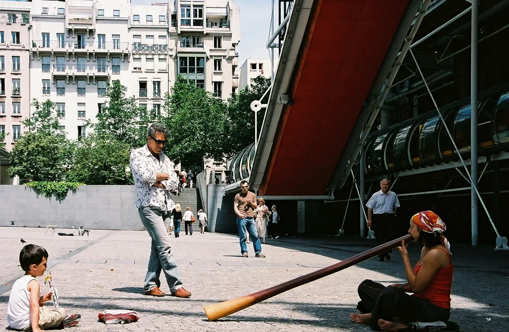 A woman plays a didgeridoo outside the National Museum of Modern Art in Paris, France.