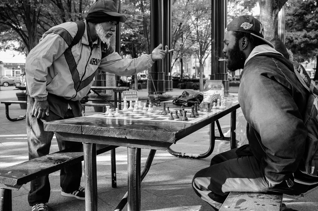 James Magnum (left) competes against another player in a game of chess at Woodruff Park in downtown Atlanta.