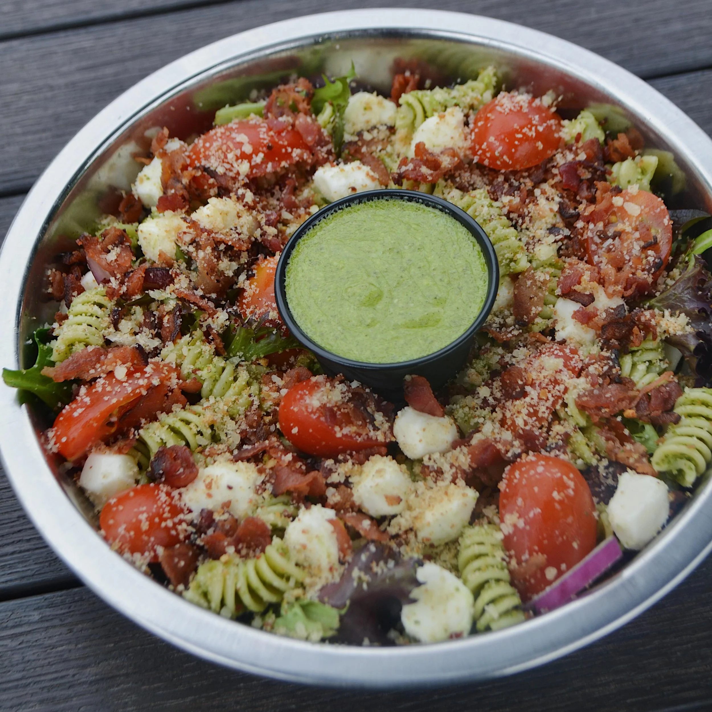 Not your average salad. Spring mix, fusilli pasta, juicy tomatoes, toasted Parmesan bread crumbs, mozzarella pearls, red onions, crispy bacon &amp; delicious lemon basil pesto dressing. 

#InstitutionAleCo #InstitutionAleCoSb