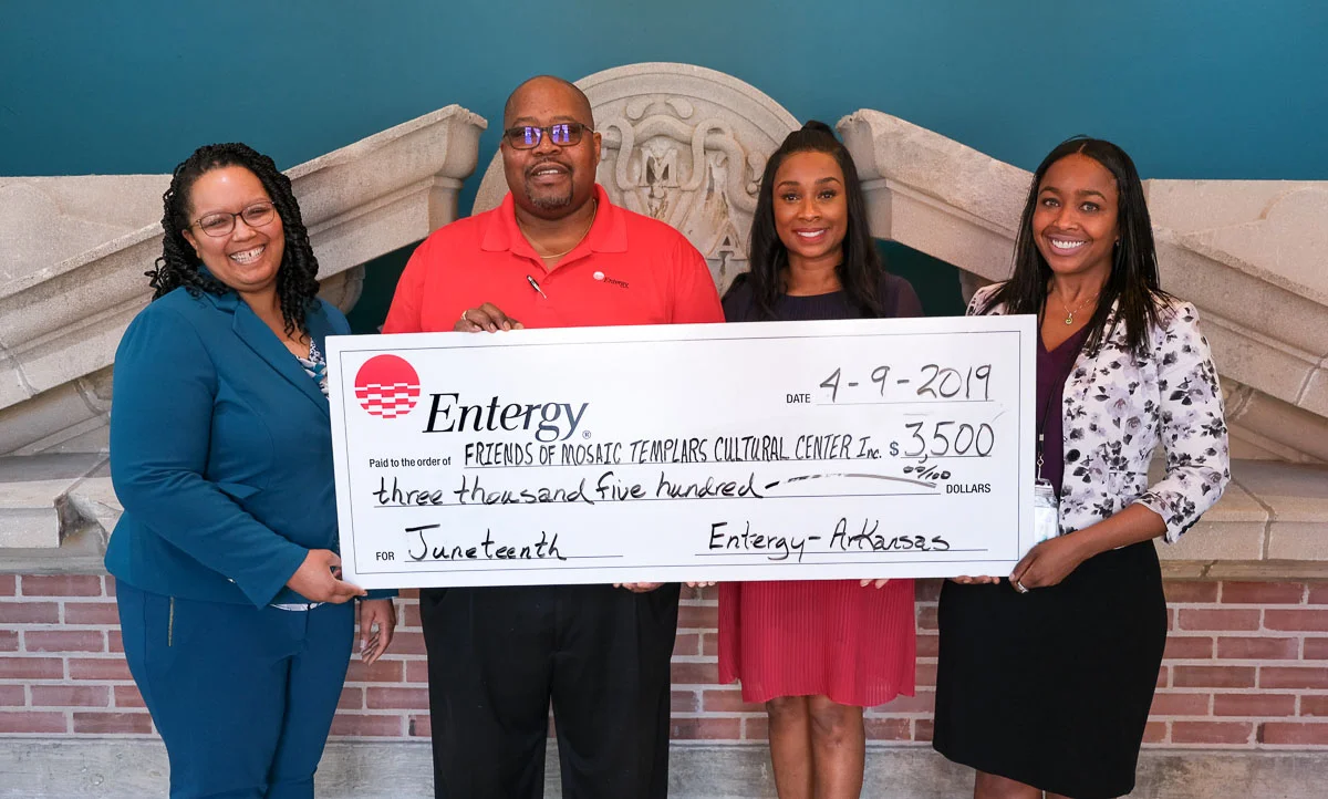 FMTCC President Martie North Hamilon (second from right) with treasurer Jay Hartman present a check from Entergy Arkansas to MTCC Director Christina Shutt (left) and Development Director Jaimie Wright.