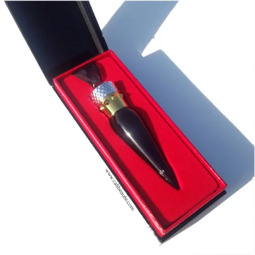 Here's an image of the Silky Satin Lip Colour also in the color Rouge Louboutin. As you can see, it has a glossy exterior finish and it's topped with a unique crown.