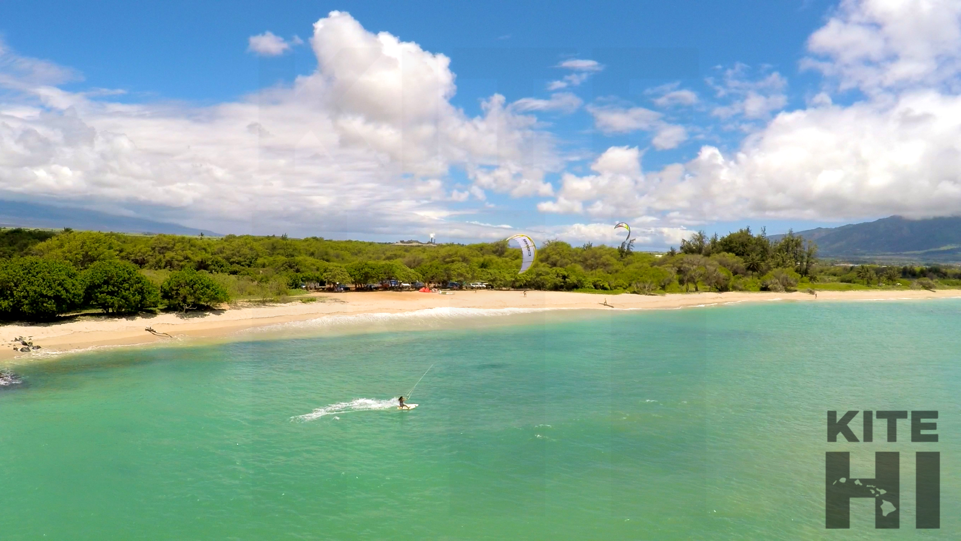 Raquel riding in front of kite beach aerial.jpg