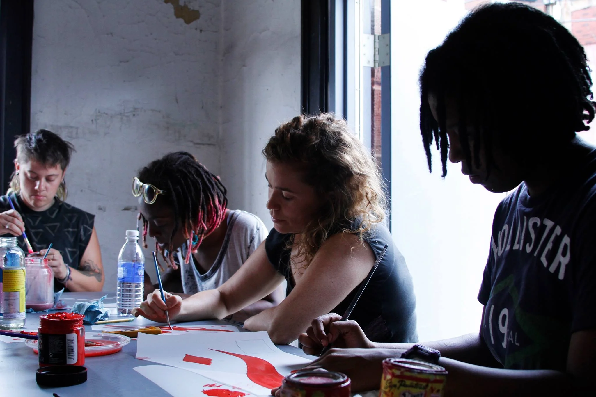 Swoon and local residents at work. ( photo : Tod Seelie)