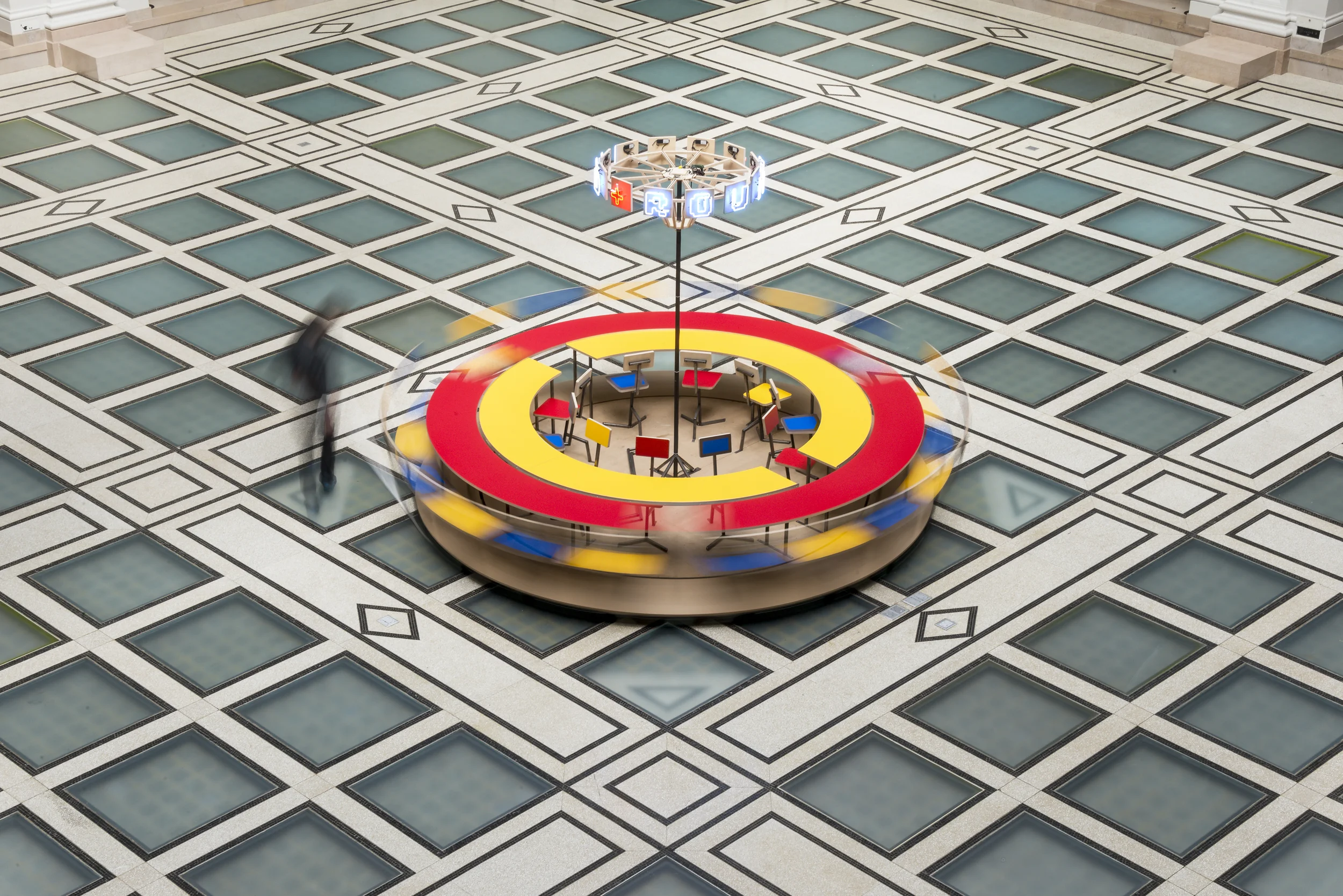 Until the Cows Come Home (2014), as installed at the Brooklyn Museum in 2014. Steel, neon, laminated mdf, pine; 60 x 168 in. (table), 24 x 60 in. (neon centerpiece). ( photo : Giles Ashford)