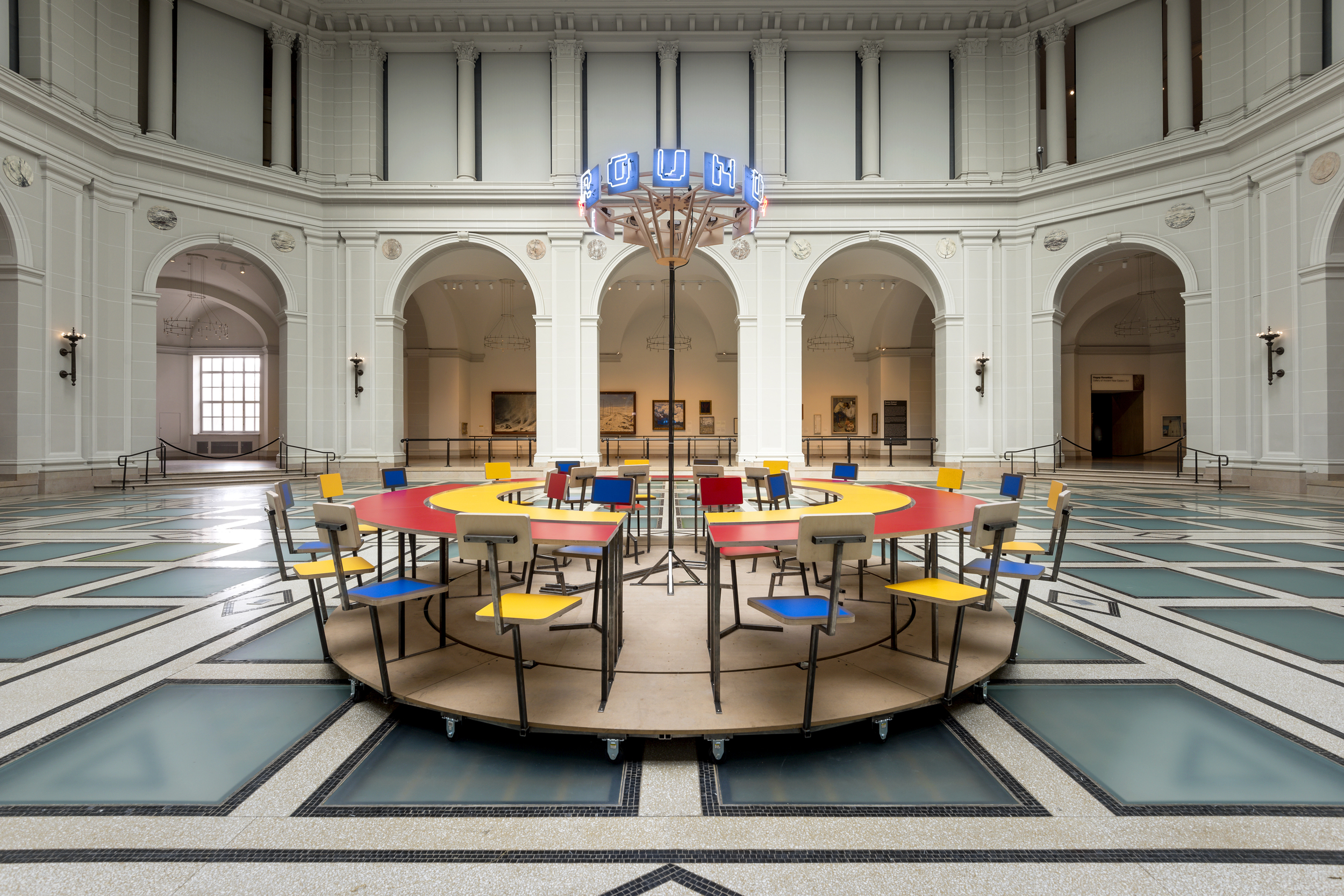  Until the Cows Come Home  (2014), as installed at the Brooklyn Museum in 2014. Steel, neon, laminated mdf, pine; 60 x 168 in. (table), 24 x 60 in. (neon centerpiece). ( photo : Giles Ashford) 