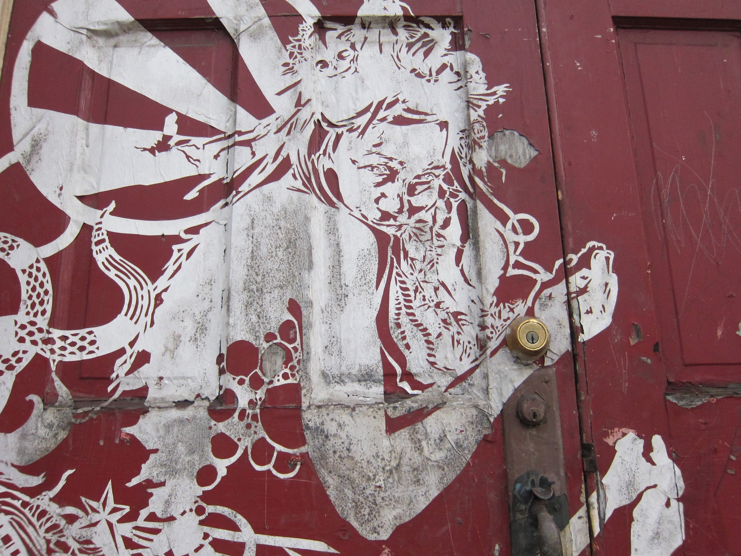  A 2010 pasted work adorning the door of a formerly abandoned church in Braddock, Pennsylvania – now home to the Braddock Tiles community arts initiative. ( Photo : Tod Seelie)&nbsp; &nbsp; &nbsp; 