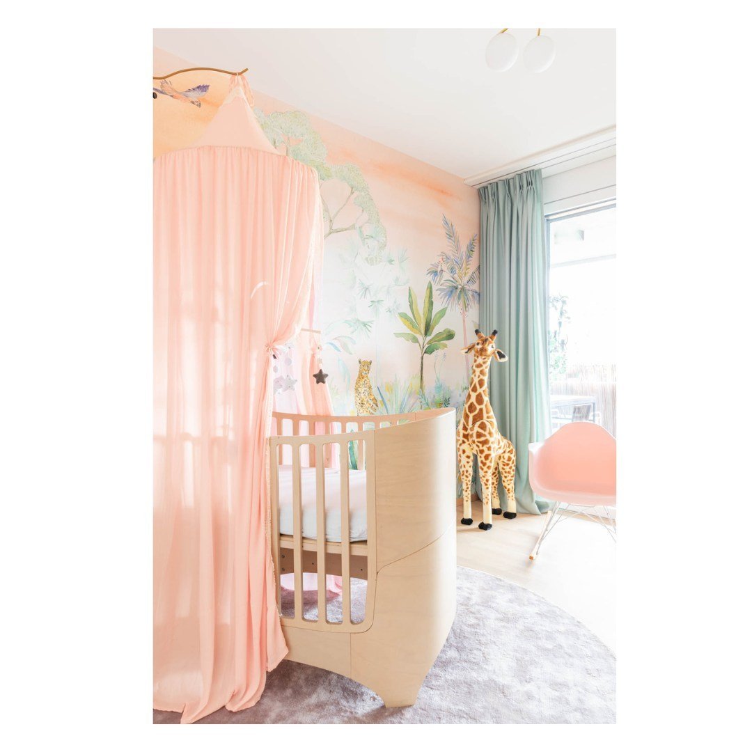 Playing with light in the nursery. The luminous tones of our panoramic selva atardecer wallpaper bring such a magical vibe to the room, creating a space filled with joy and tranquility. Who else adores the soothing charm of pastels? #NurseryDecor #Pa