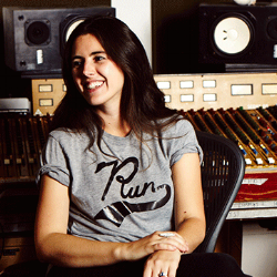 Ivor Novello Winner and BAFTA nominated composer Natalie Holt has created dramatic original scores for feature films, television drama, and narrative-driven entertainment. Her latest projects include BBC’s powerful drama Three Girls (Dir: Philipa Lowthorpe) and the feature film Journey’s End (Dir: Saul Dibb). She also composed rich, emotional scores for the BBC drama My Mother and Other Strangers, the final series of BBC1 hit drama Wallander starring Kenneth Branagh, and has written award winning music for the BBC’s Great Expectations,The Honourable Woman (Dir: Hugo Blick) and ITV’s Victoria with Martin Phipps. Holt’s music can also be heard alongside Hans Zimmer’s in the Weinstein company film Woman in Gold, and in the family smash hit from the producers of Harry Potter, Paddington. Natalie trained in composing at the National Film and Television School after studying violin at the Royal Academy of Music. Her diverse repertoire ranges from epic scores recorded with 80-piece orchestras to intimate, small ensembles and hybrid electronic scores featuring an eclectic mix of live solo instruments. To create unique sounds for each project, she draws from her large collection of instruments. As a highly accomplished musician herself, who performed at the Olympic Closing Ceremony, Natalie personally performs on most of her scores. Based in London, the heart of Europe’s post-production community, she regularly records with A-list orchestras at major studios including Abbey Road and Air Studios, and works with filmmakers in Los Angeles, London and with commercial clients worldwide. In 2017, Natalie was given the prestigious accolade of being made an Associate of the Royal Academy of Music.