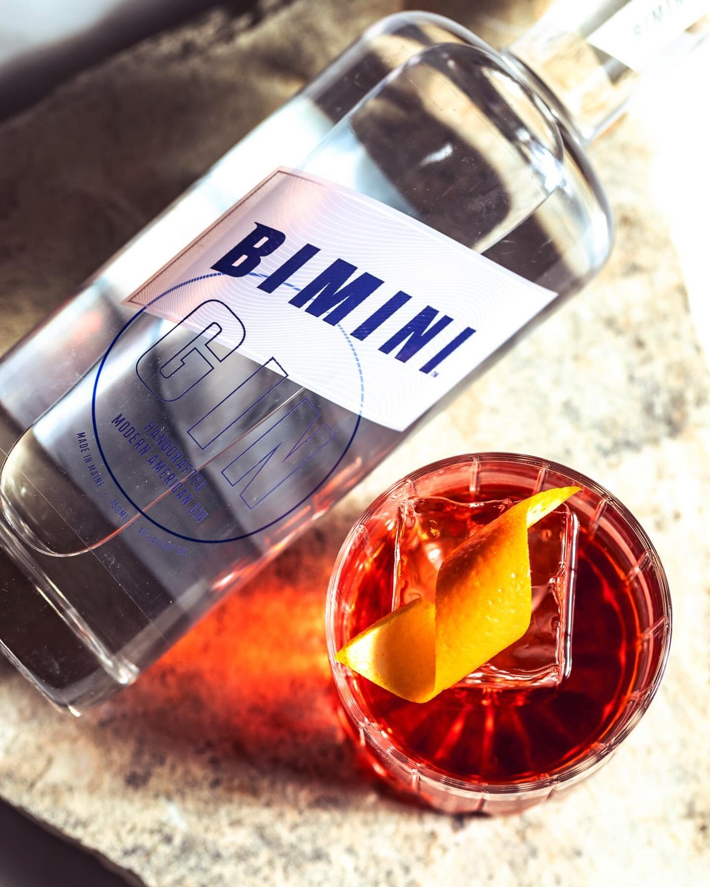 Been waiting all week for Friday aperitivo hour on the patio? A classic Negroni is the perfect choice to enjoy while relaxing with friends. With a bright citrusy profile, fresh juniper backbone, and sweet floral notes of hops and chamomile, Bimini Gi