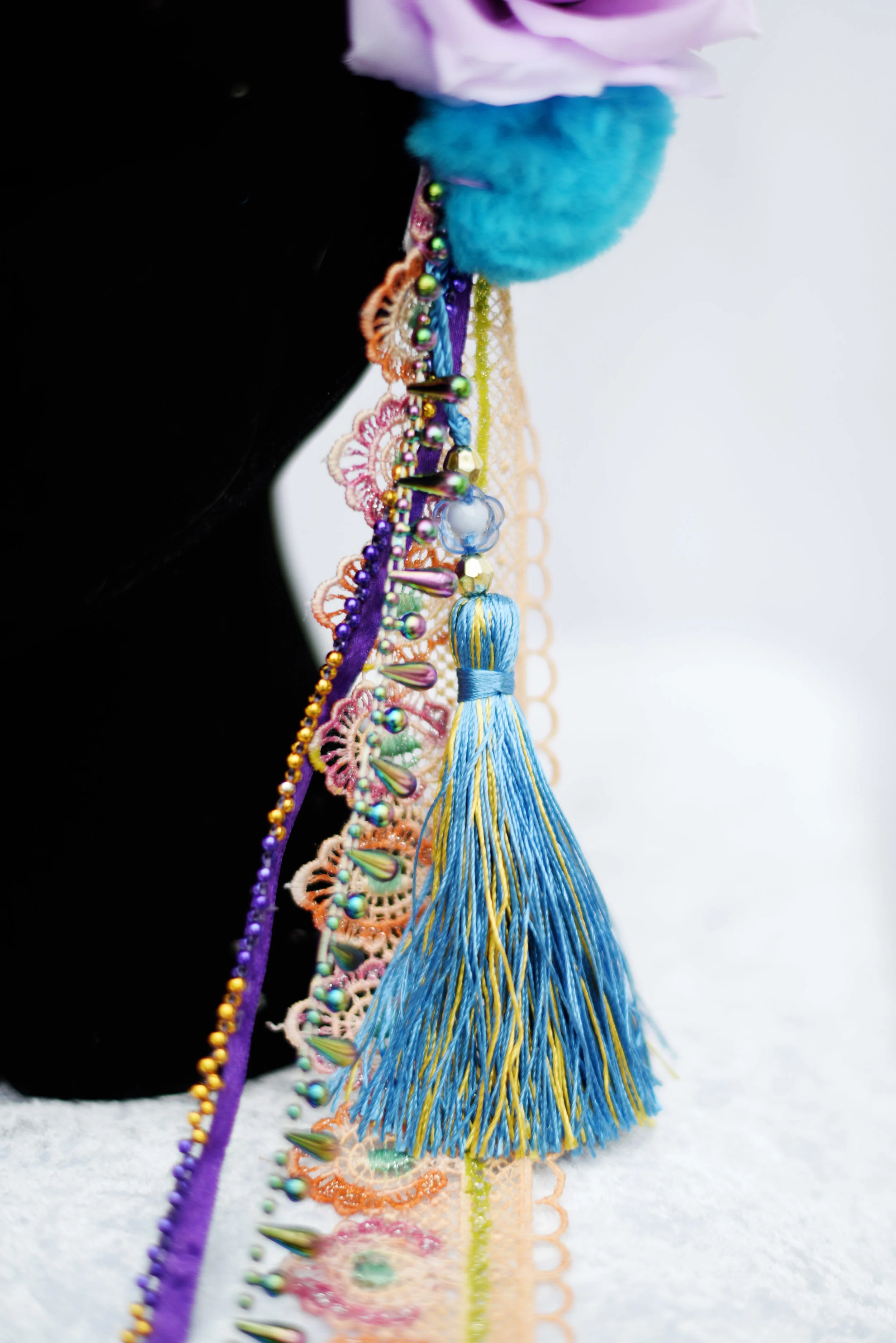 coral & purple headdress trimmings close up.jpg