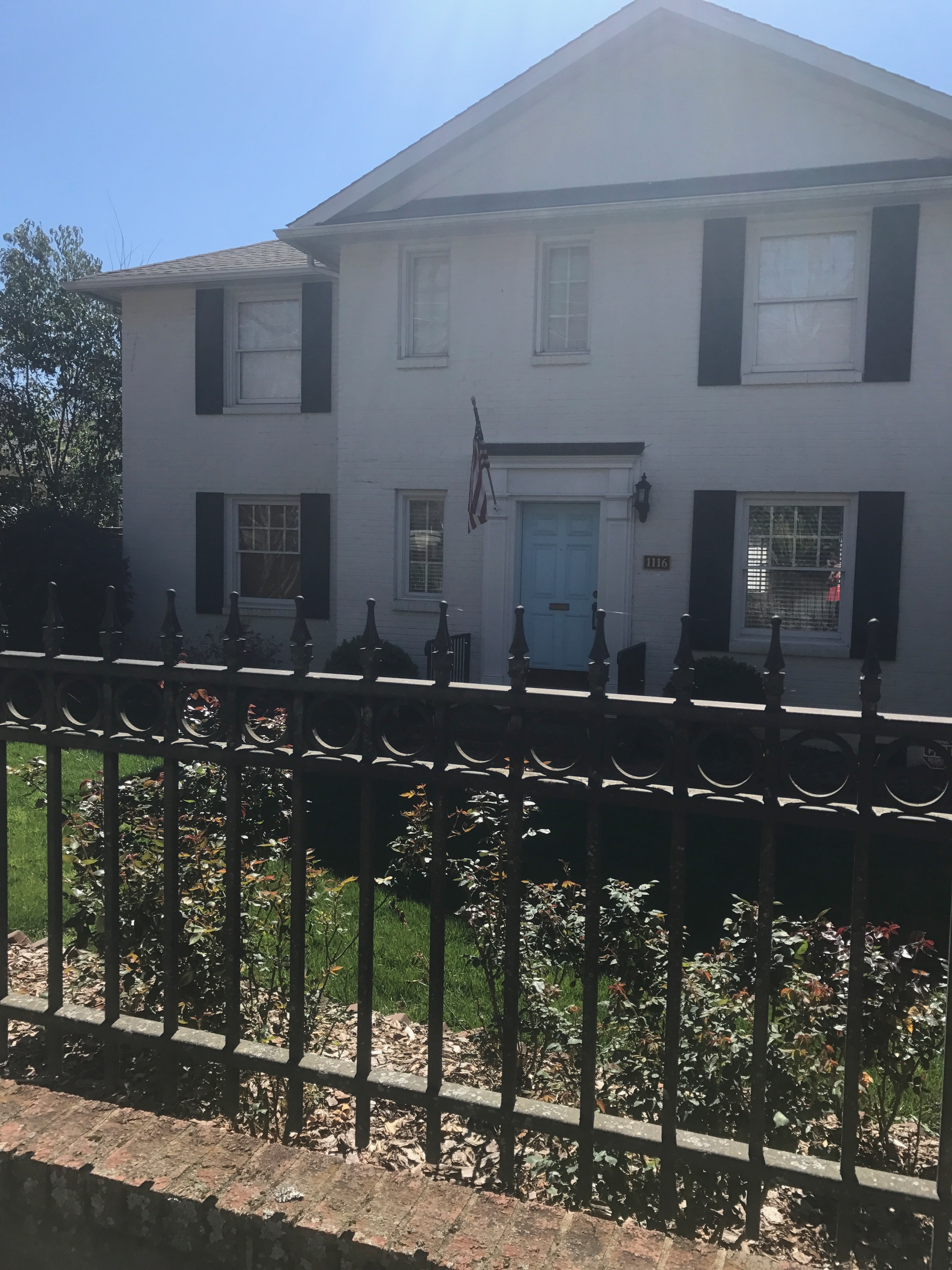 { This classic southern house caught my eye on my weekend run. I love the contrast of the white against the sky blue door! }