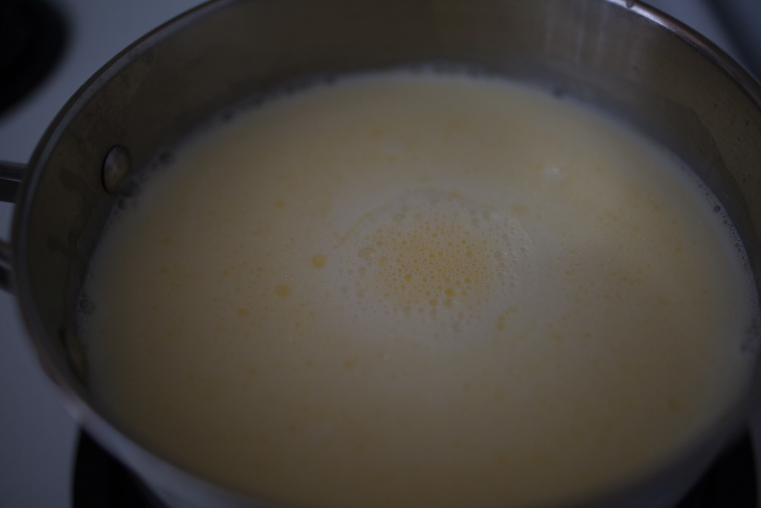 The rich fat of the milk warming up and separating. It looks like melted butter on top. Beautiful. 