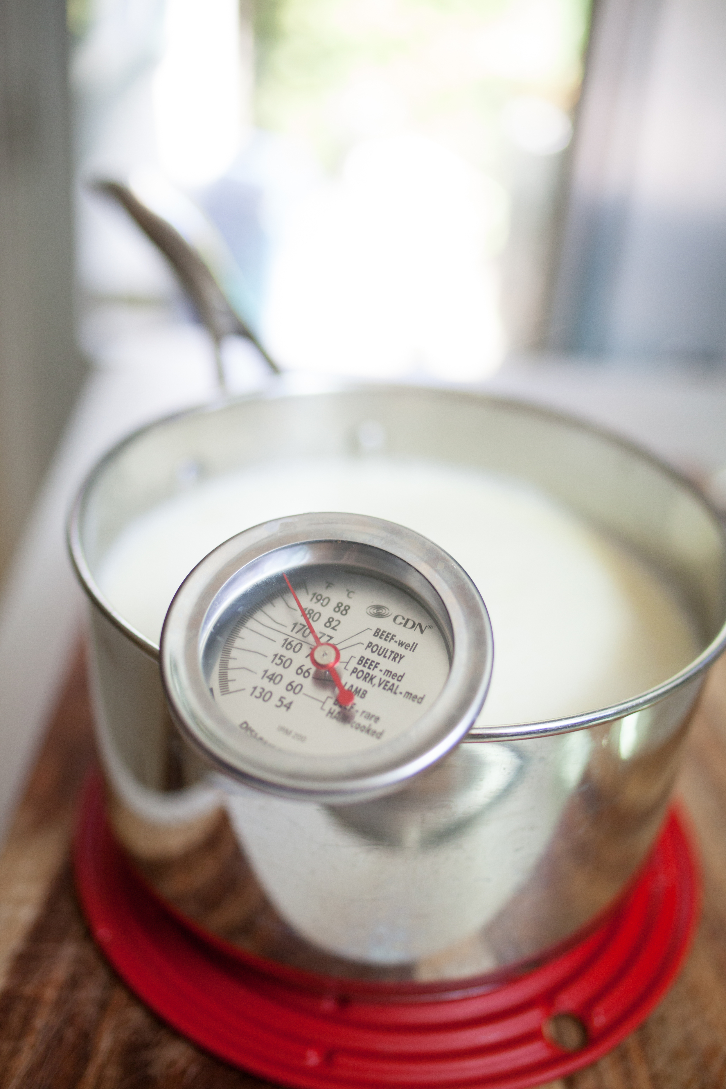 Once your stove temperature reaches 180 F, remove from heat, and let the temperature cool. Once your milk reaches 108-112 degrees Fahrenheit, add in your leftover yogurt or yogurt culture starter and mix thoroughly. 