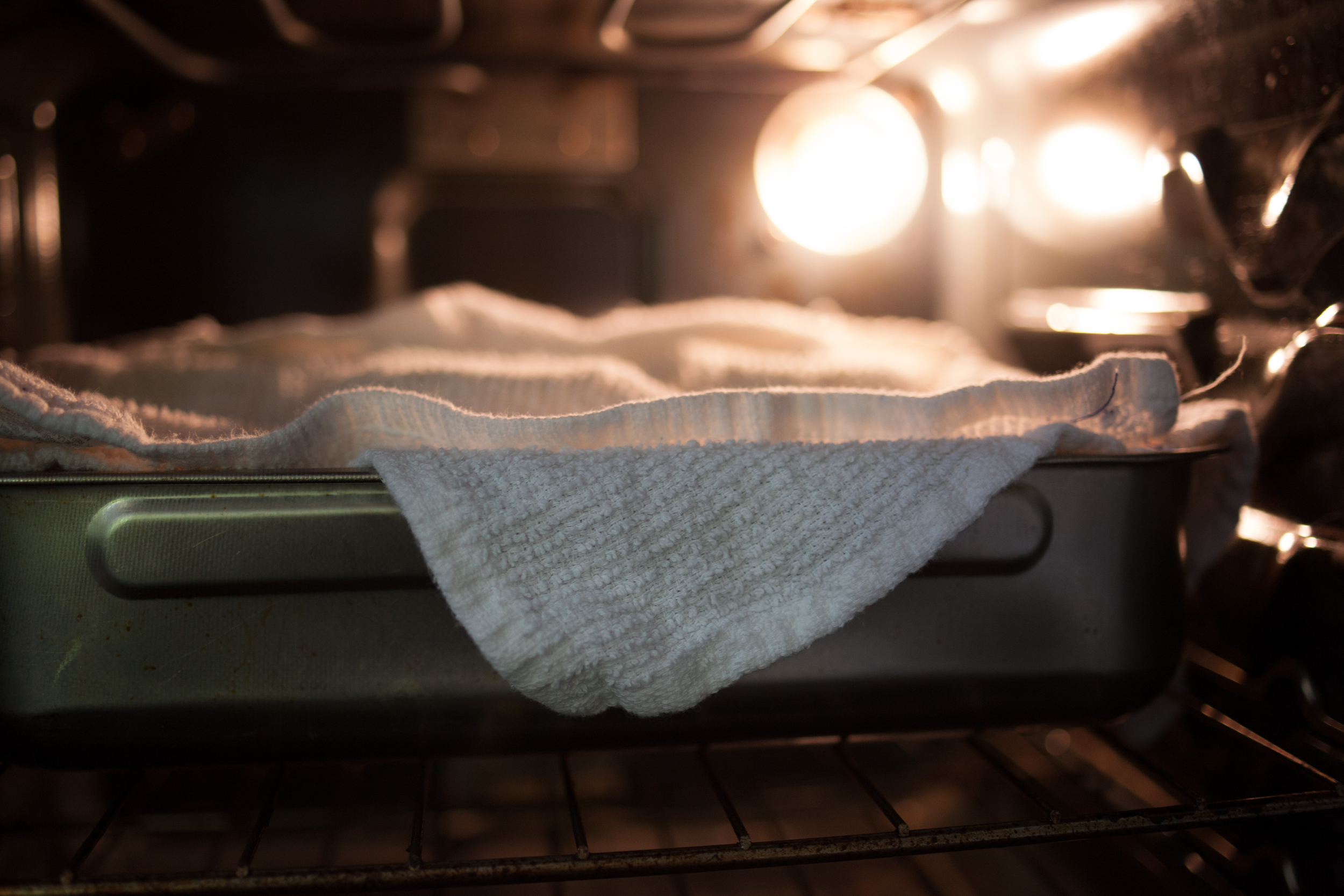Because we have a little kitchen, we have a little stove....while I go ahead and keep the gourmet kitchen dream alive.....this slightly dirty, electric baby does the trick. Incubate your yogurt for 4-5 hours or until the yogurt has reached the desired firmness. 