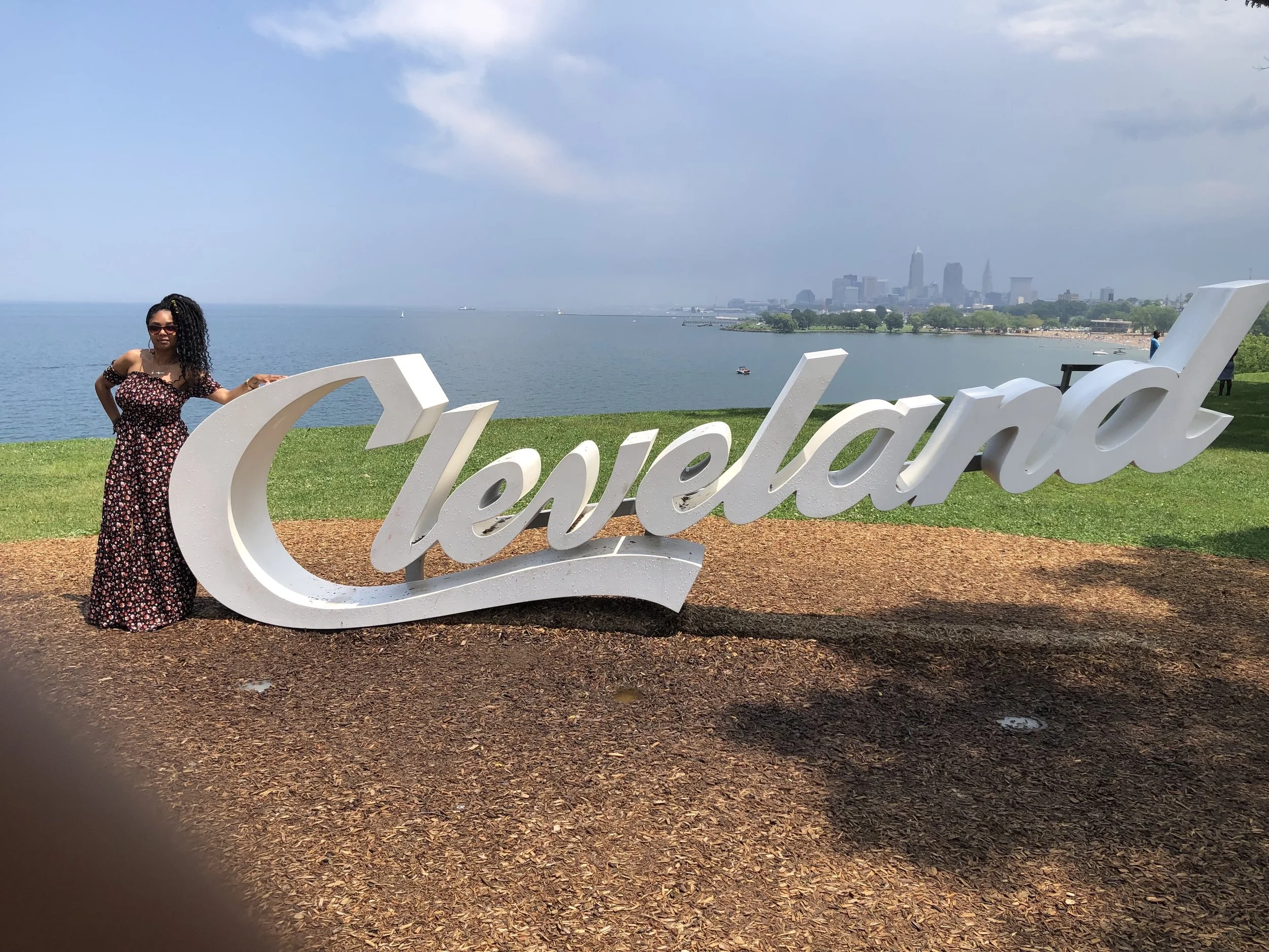 Jennifer J. at one of the four Cleveland landmarks throughout the city. She has pictures with three out of four.
