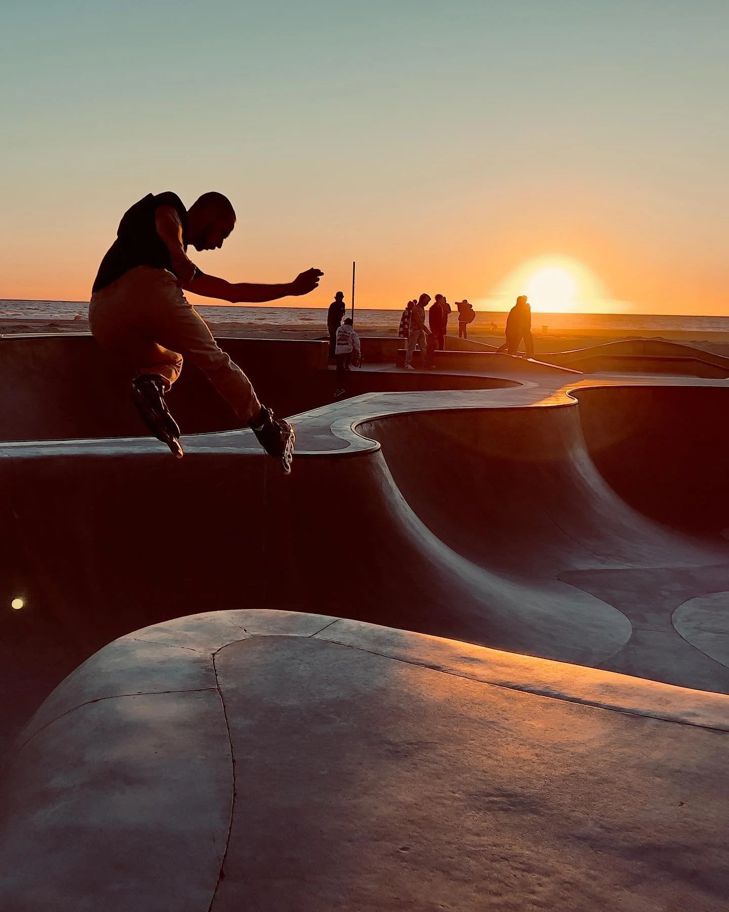 I am back in LA after being in El Paso Texas for almost two months. I live half a block from the beach ποΈ now which is awesome and caught this sunset today. #venicebeach #veniceskatepark #iphone13promax