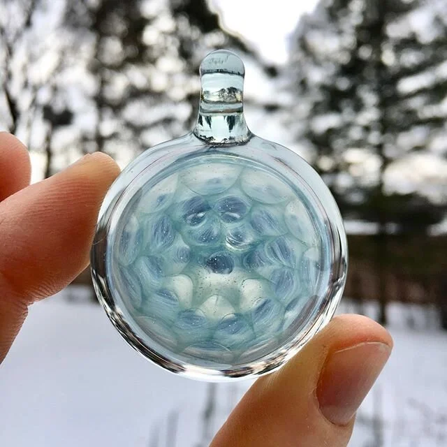 Freshhh honeycomb pendant. Features glass alchemy&rsquo;s Zen and Nimbus. Super difficult for me to photograph but hopefully communicates its subtle blue and teal hues. 
#glass #headyglass #boro #heady #headypendants #gazen #ganimbus #glassalchemy #c