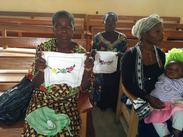 North Katanga women sharing the items they sewed with the supplies we provided.