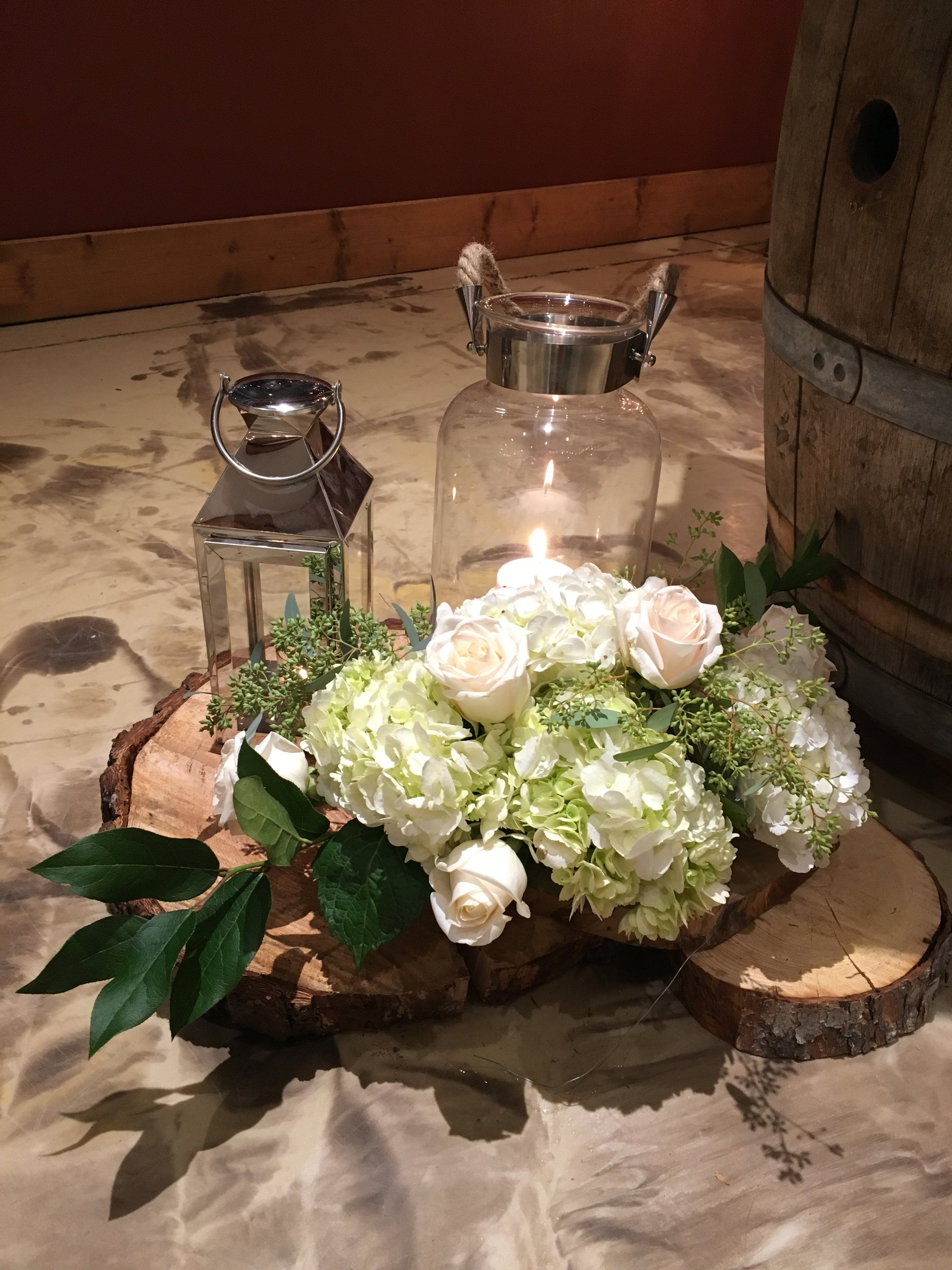 The day was filled with so many fun details made by the Father of the Bride. From the living edge guest book table to birch wine bottle holders, birchwood arch, and birch tea light holders for each guest to take home.