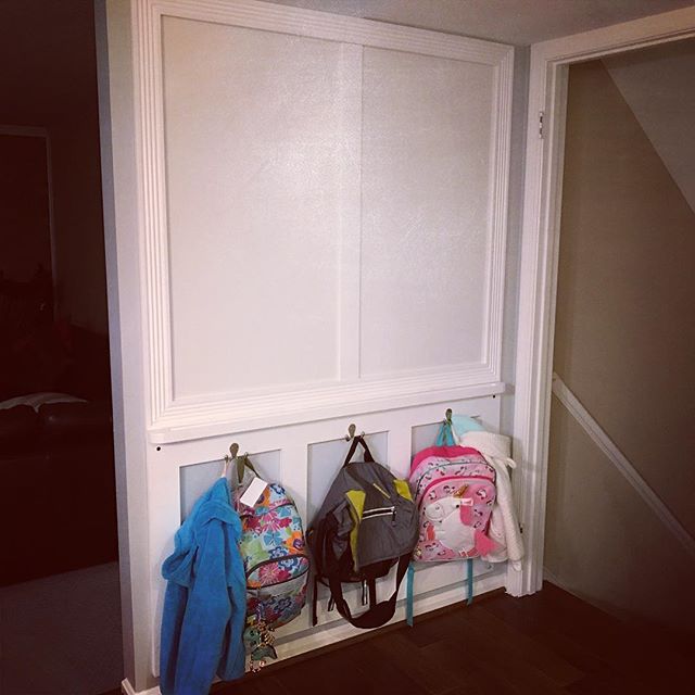 Not too shabby for a quick #project!  Two dry erase panels in the top framed out in #molding with a marker tray below and a few boxed hooks for backpacks below. Certainly not ground breaking, but it's nice to see the floor again!  #woodworking #shabb