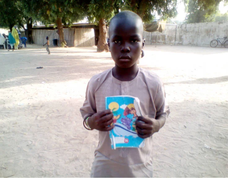 Ibrahim Street Child Nigeria read write.jpg