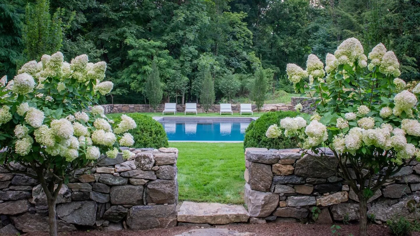✨ holiday weekend ready✨
Framed by antique walls newly reconfigured, a pool set in lawn invites calm and balance. PeeGee&rsquo;s, boxwood, hornbeams, and lindens layer softness with structure against natural woodland edges&mdash;celebrating the end o