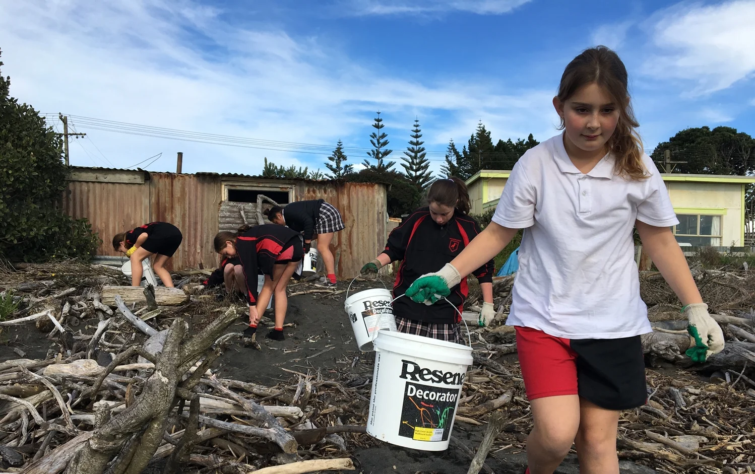 Manukorihi students cleaning up Waitara beach.