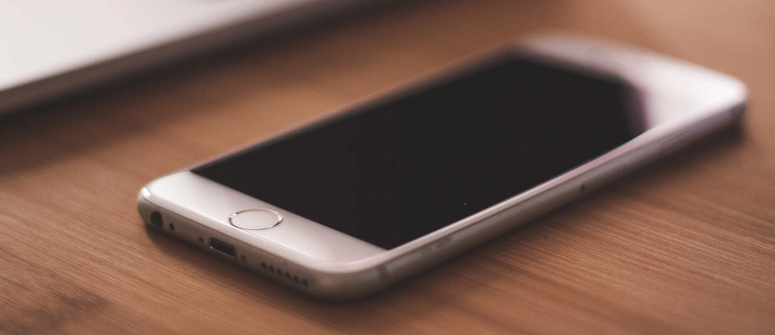 negative-space-iphone-white-macbook-desk.jpg