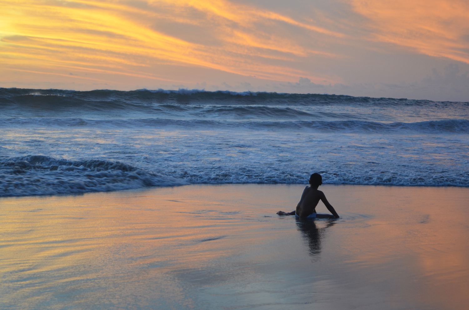 Beautiful sunsets in Seminyak. The beach has dark sand and huge waves excellent for surfing!