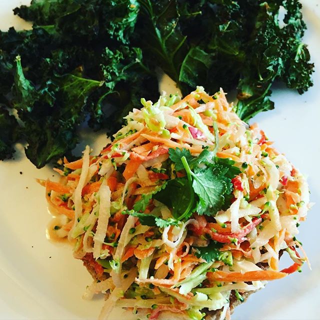 Turkey burger hidden under broccoli &amp; carrot slaw with a side of chili pepper kale chips #paleo #getinmybelly #cleaneating #eatrealfood #kmtherapyandwellness