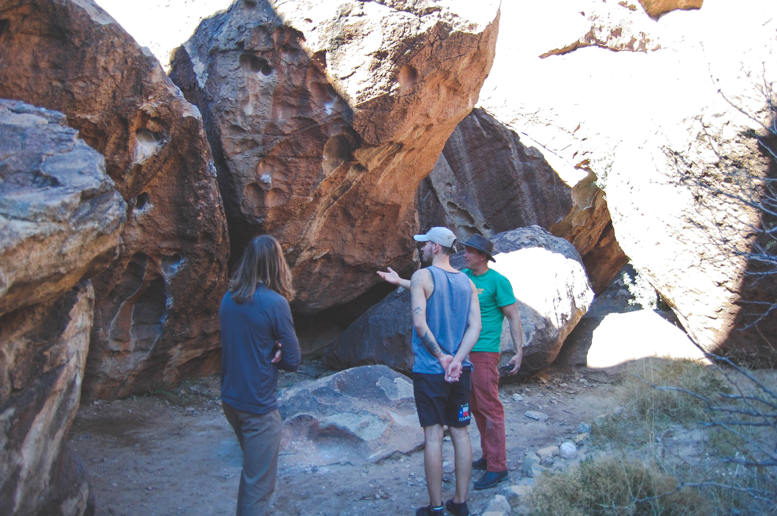 Doland (Left) Denis (Center) and our Guide, looking at a few warm up routes in Hueco Tanks.