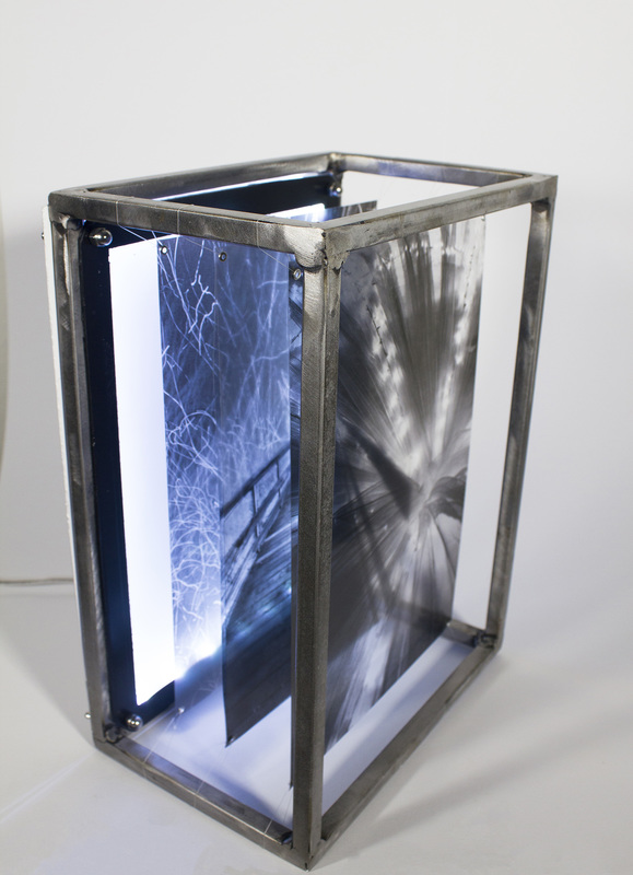 Kristina McComb, Lacy Pathways (2015). steel, plexiglass, and transparent film. 14 x 10 x 7 in.
