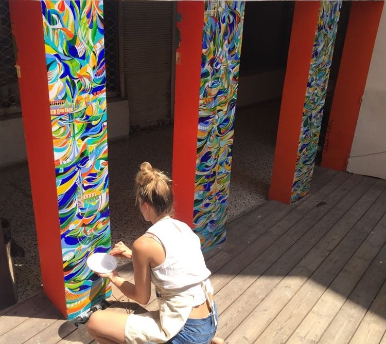 Wróbel working on her public art project at the Rena House, in Tel Aviv, Israel, image courtesy of the artist. 