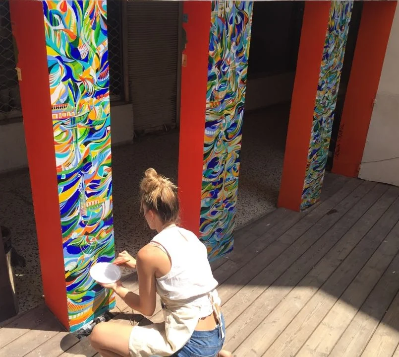 Wróbel working on her public art project at the Rena House, in Tel Aviv, Israel, image courtesy of the artist. 