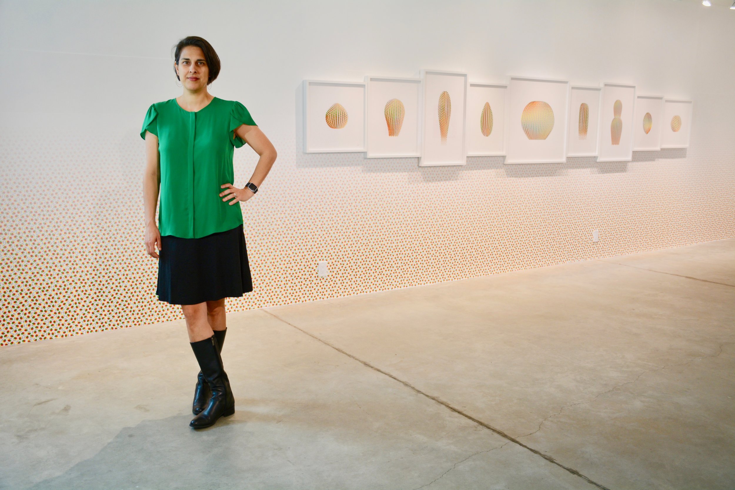 Cassandra C. Jones in front of her installation, Forever Temporary. Photo by: David Guerra