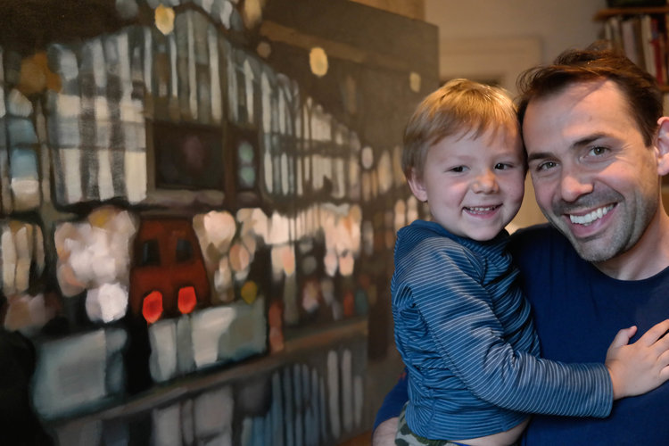 Mishael Coggeshall-Burr and his youngest son, Nazar, in front of his latest work, Gare du Nord. Photo courtesy of the artist, 2019.