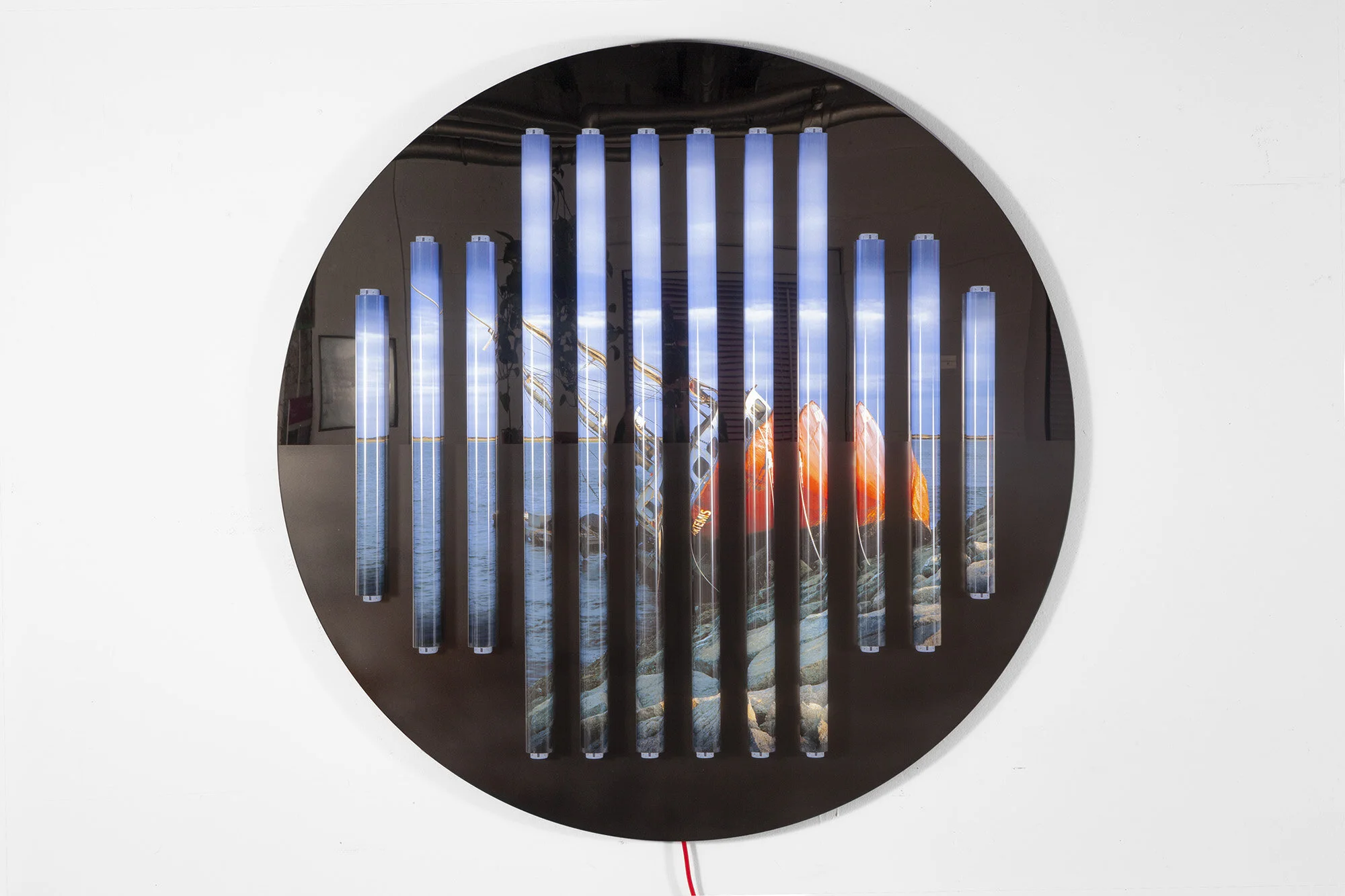 Clint Baclawski Ashore, 2020 Bronze mirrored Plexiglas with etching on black Plexiglas, archival pigment backlight prints, clear polycarbonate tubes, 3', 2', and 18" LED bulbs 46 x 46 x 3 in. Ed. 1 of 3