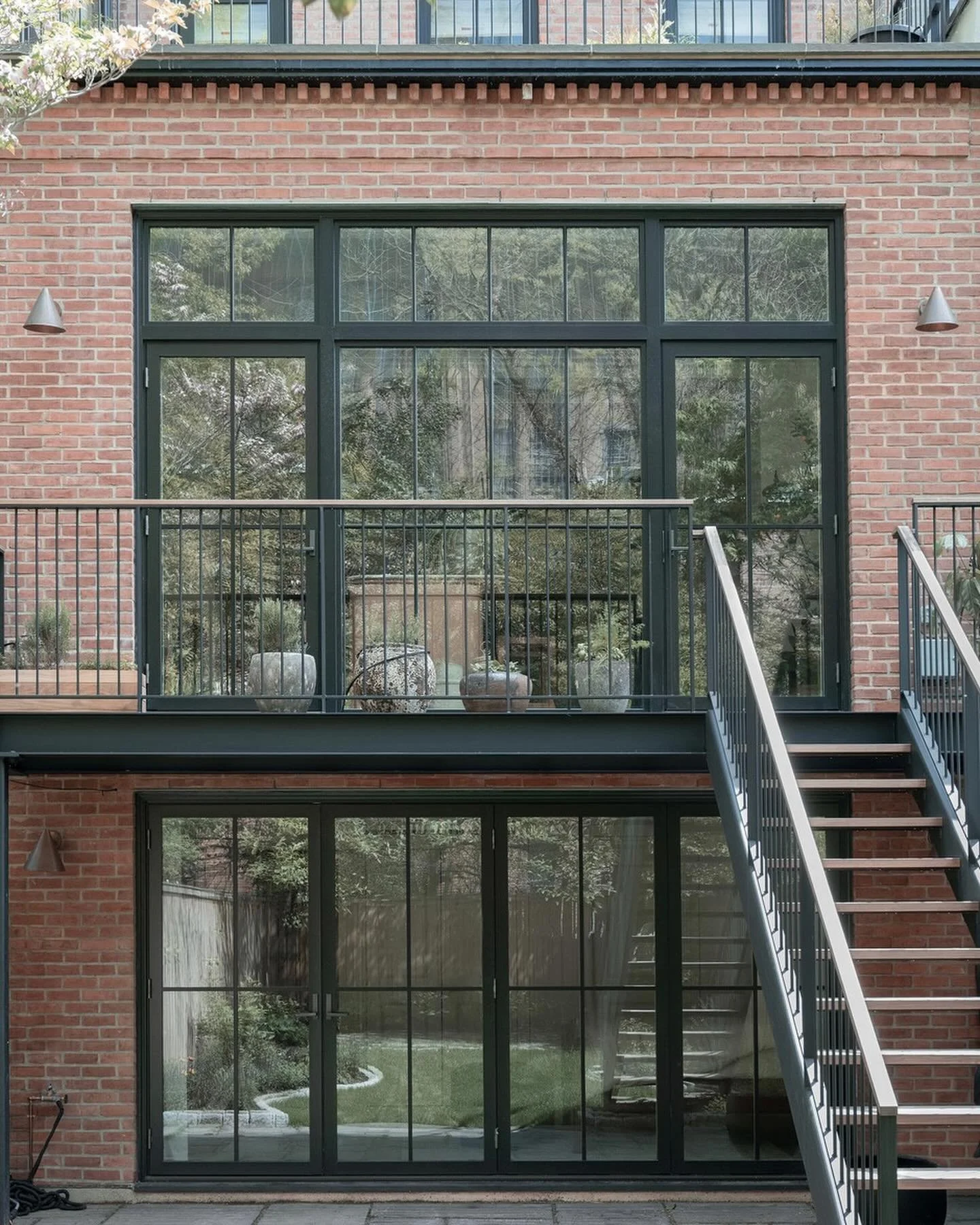 Before and After 
Fort Greene Townhouse renovation and rebuild

The extensive structural rebuild of a poorly built extension provided an opportunity to open up the 2 levels with large scaled windows to the garden, blurring the boundary between indoor
