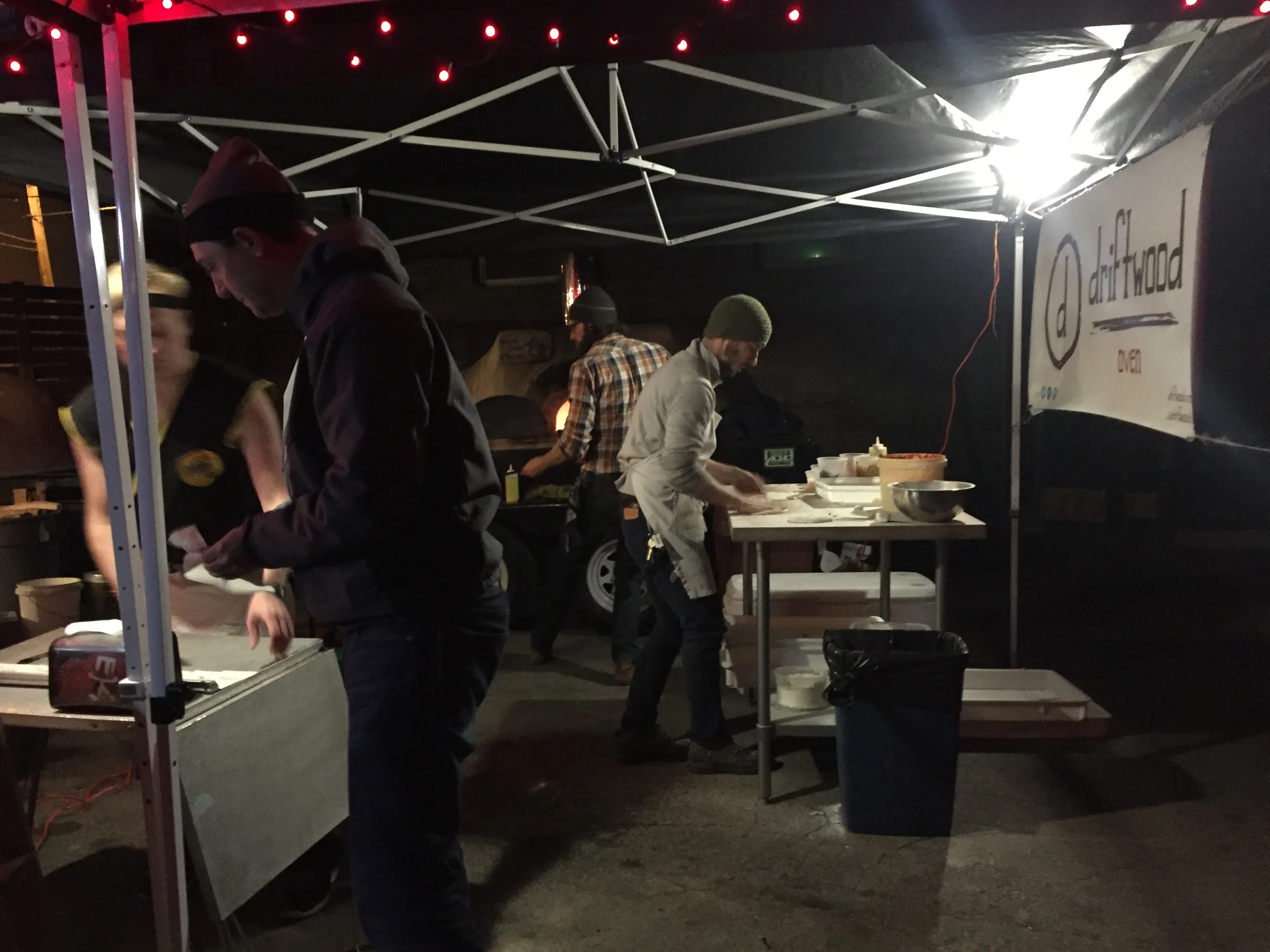 Neil and Justin work the pizza oven. They hired a ninja to work the front of house. 