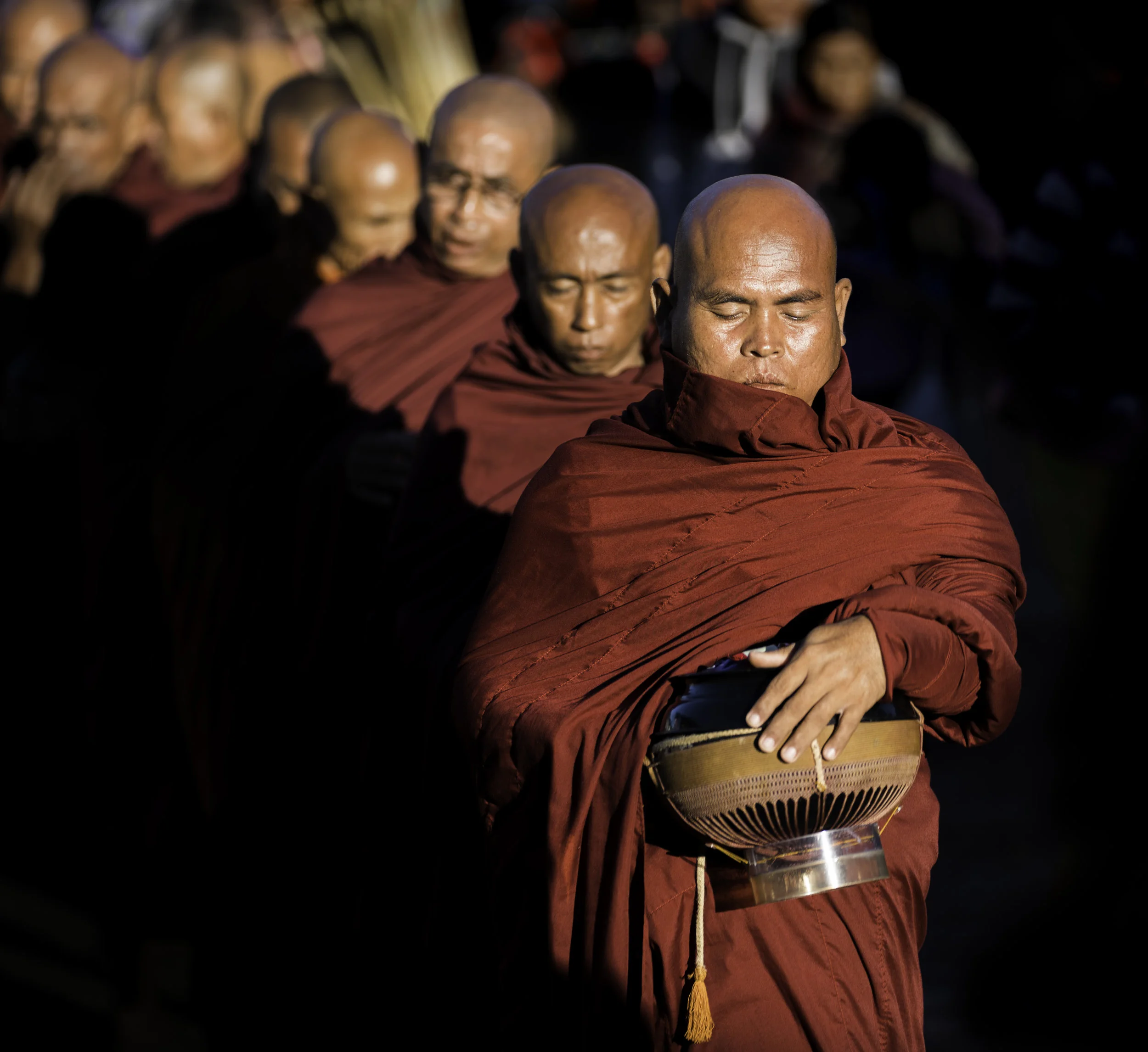 Morning Alms. Local Monks accepting morning alms in Kyaik Htee Yo. 