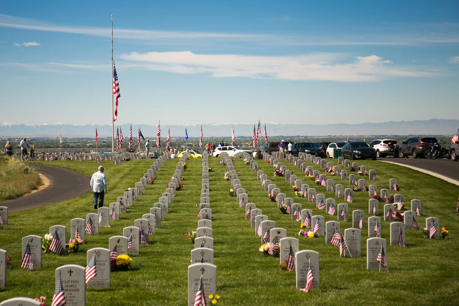 Hundreds of people gather at the Idaho Veterans Cemetery on Memorial Day to honor those who made the ultimate sacrifice.  A flyover organized by the Warhawk Air Museum flew over the Treasure Valley in honor of Memorial Day. (Kristen McPeek Phot…