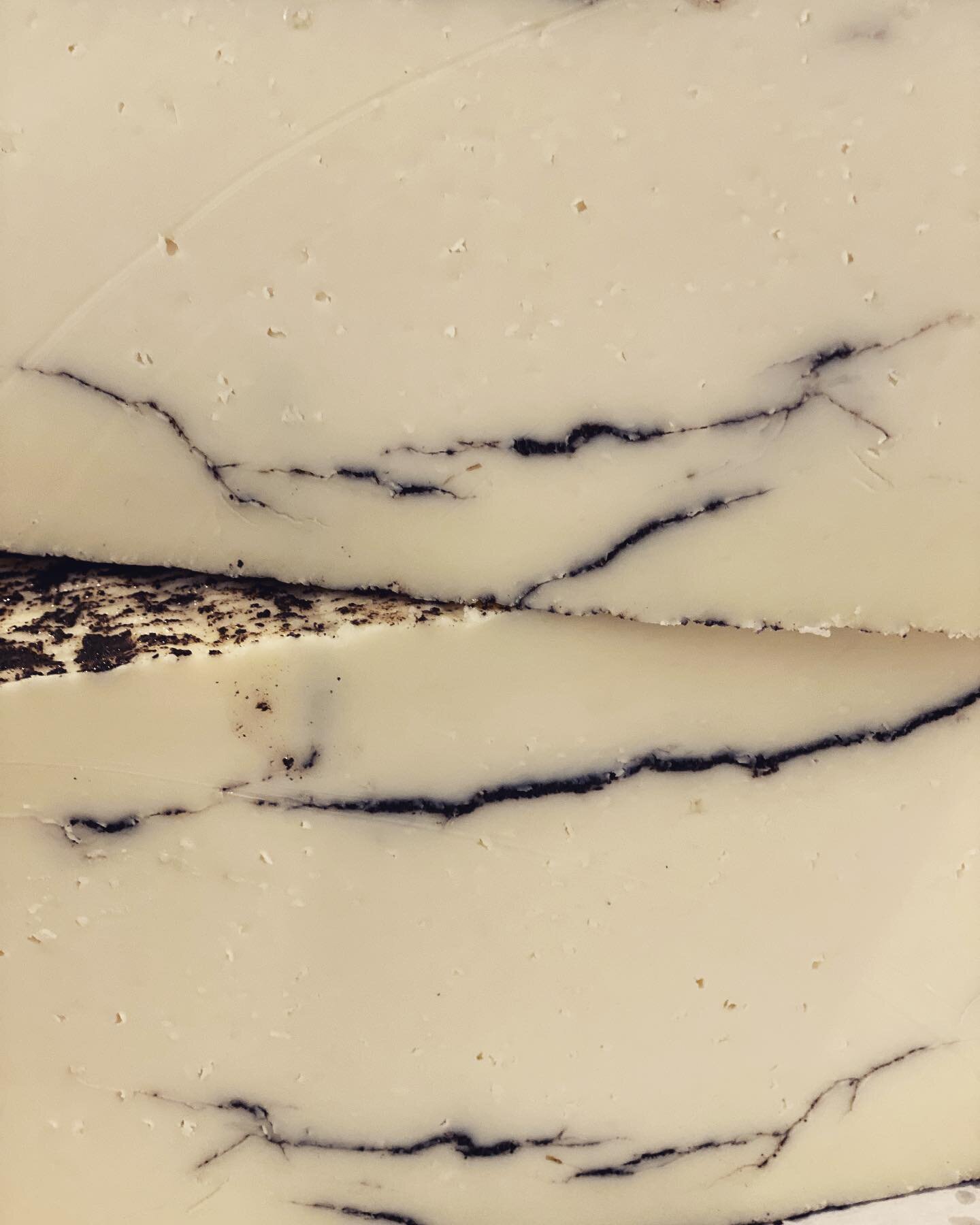 This Truffle Manchego is like a piece of artwork. New in today! Delicious flavor of truffle with a creamy texture.#cheese #cheesedisplay #cheeseboard #cheeseart #cheeselover #truffle #trufflecheese #manchego #sheep #shoplocal #smallbusiness #deliciou